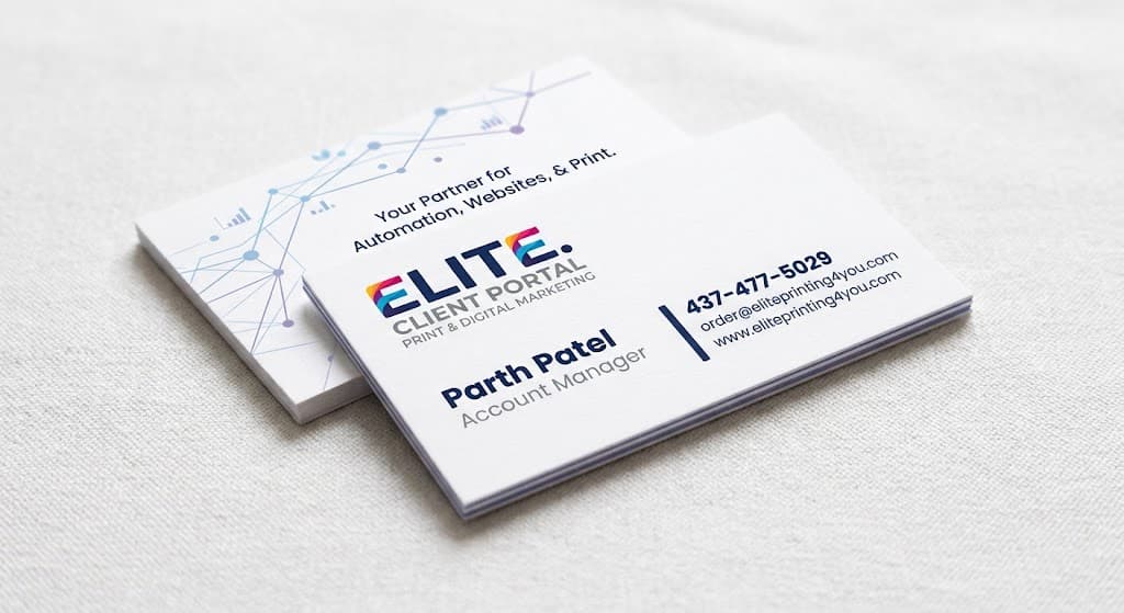 A stack of Elite business cards printed on thick white stock